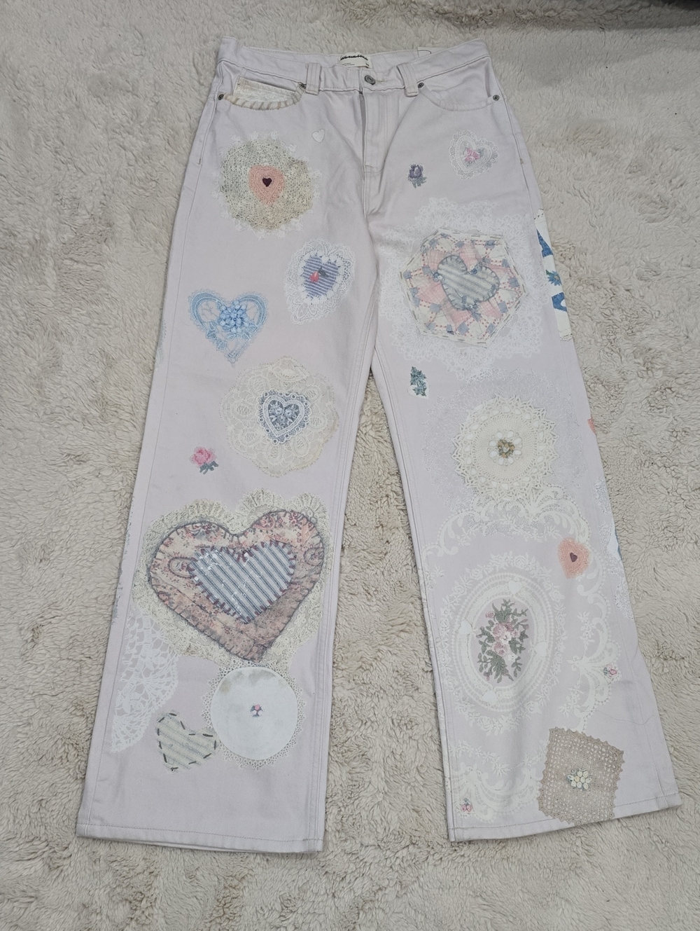 We The Free Pale Pink Flare Jeans with Heart & Lace Imprinted.